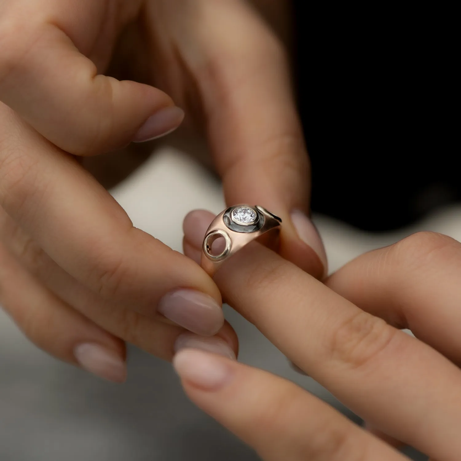 Piercing Engagement Ring with Grommets and a Grey Diamond Halo